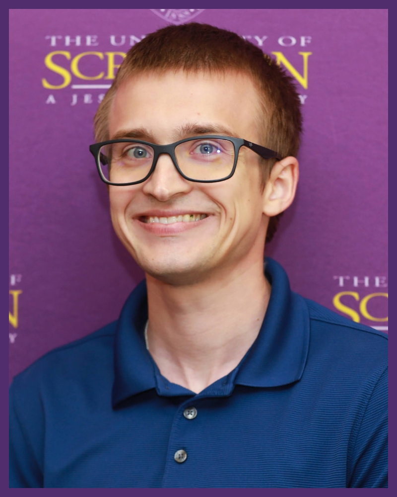 a portrait of an individual wearing glasses