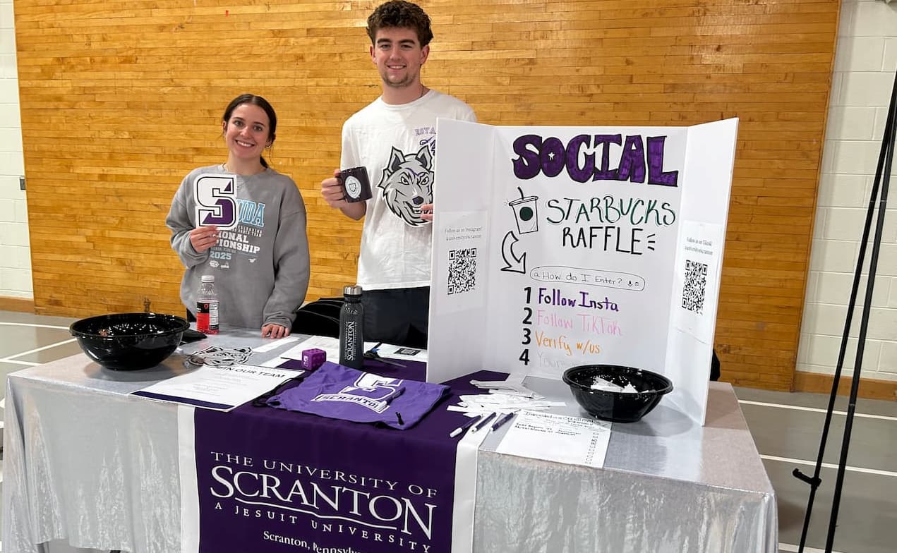 Members of the University's social media intern team are shown at the Student Activities Fair.