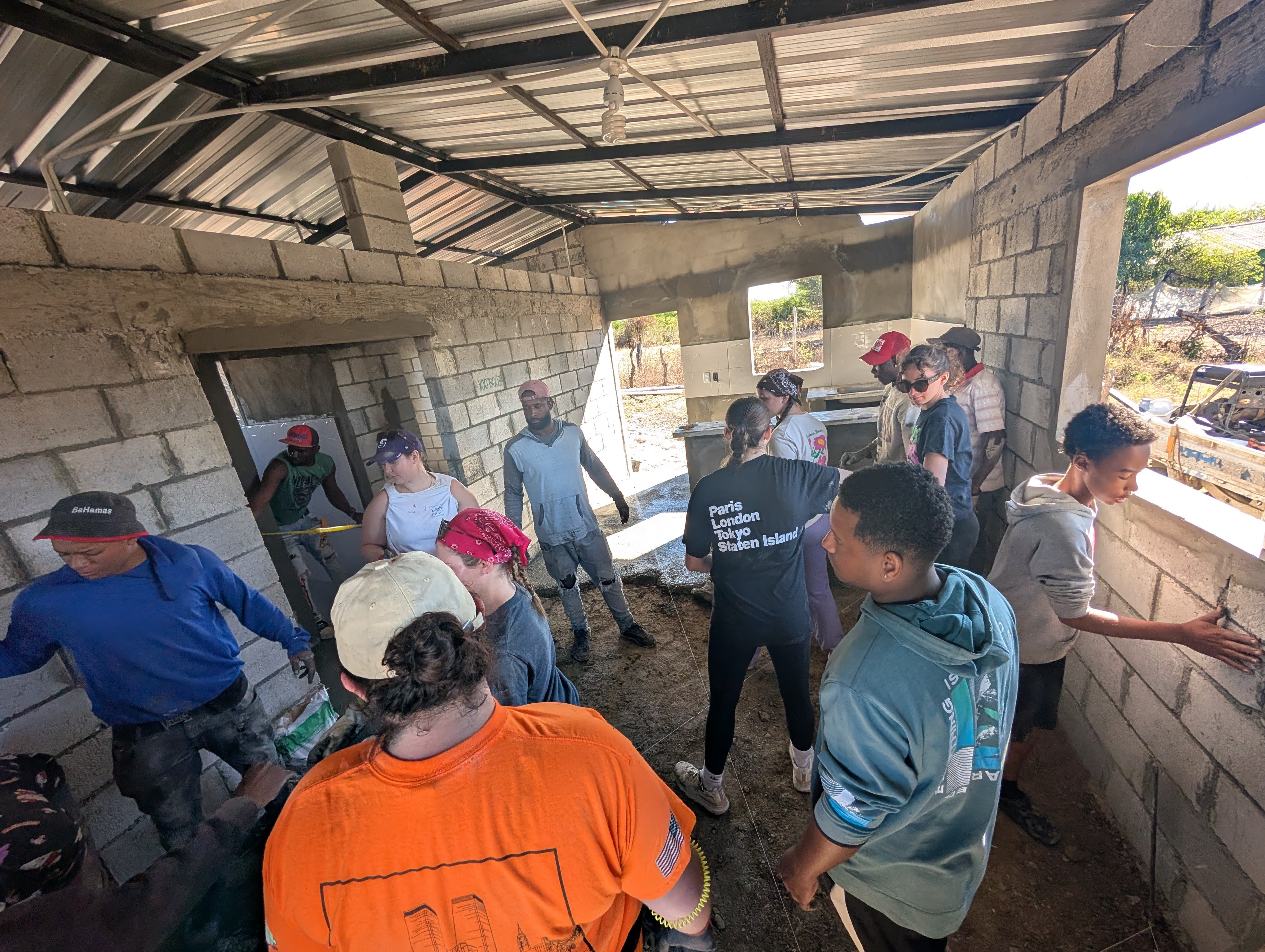 Occupational therapy students work alongside local partners during a five-day house build in San Juan de la Maguana, applying teamwork, service and principles of accessibility to support a family in need.