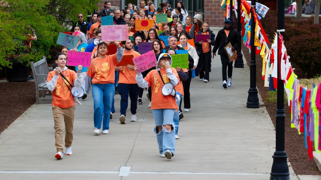 group of people walking from DeNaples along the Dionne Green