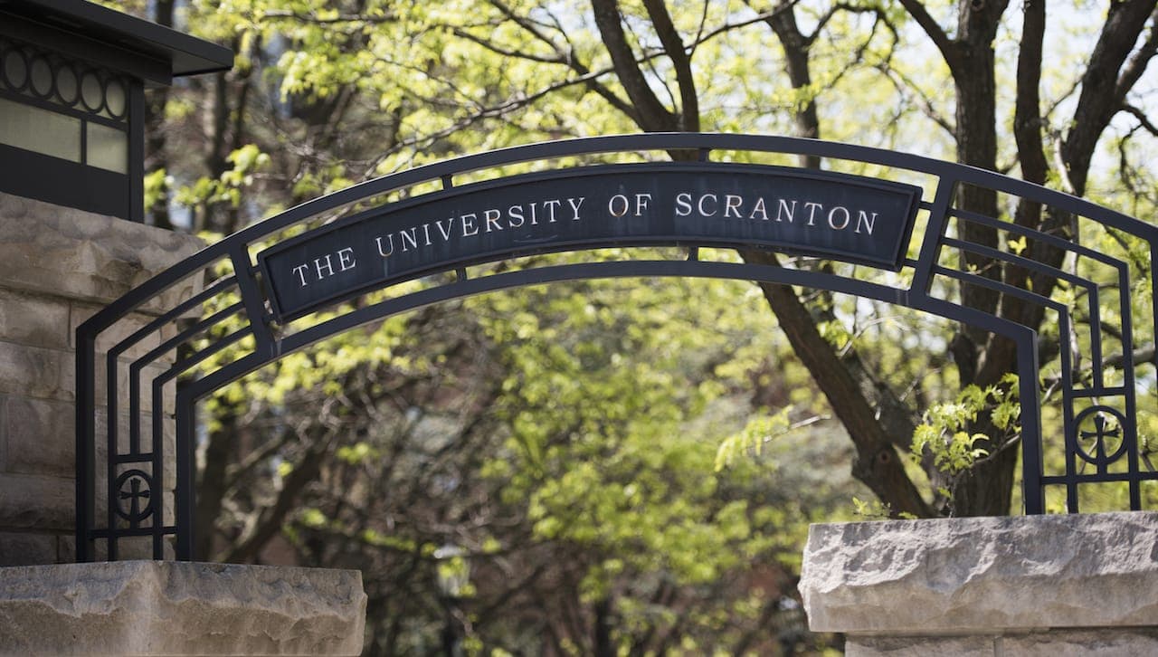 Wrought iron gateway arch etched with The University of Scranton.