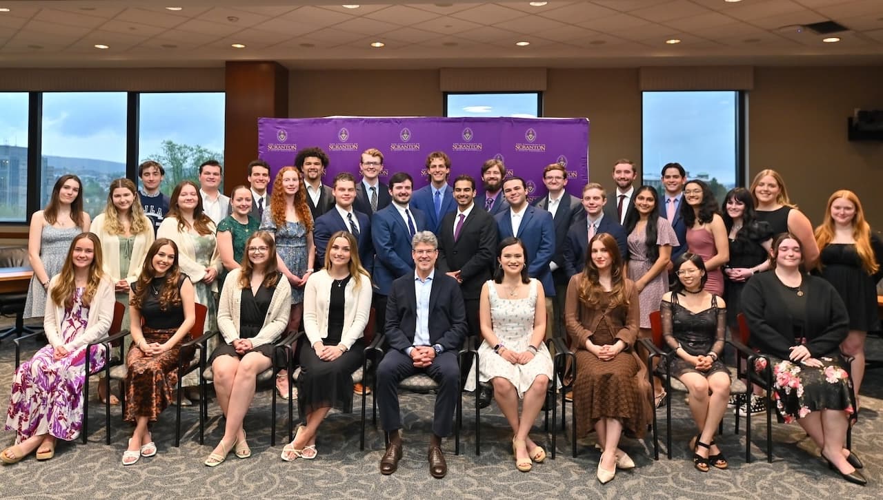 Pictured are members of The University of Scranton’s class of 2026 graduated from its Special Jesuit Liberal Arts Honors Program with the program director.