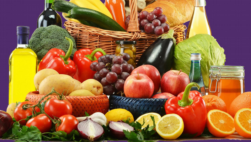 image of fresh vegetables, fruit and other food items with the text "Royal Restore Food Pantry"