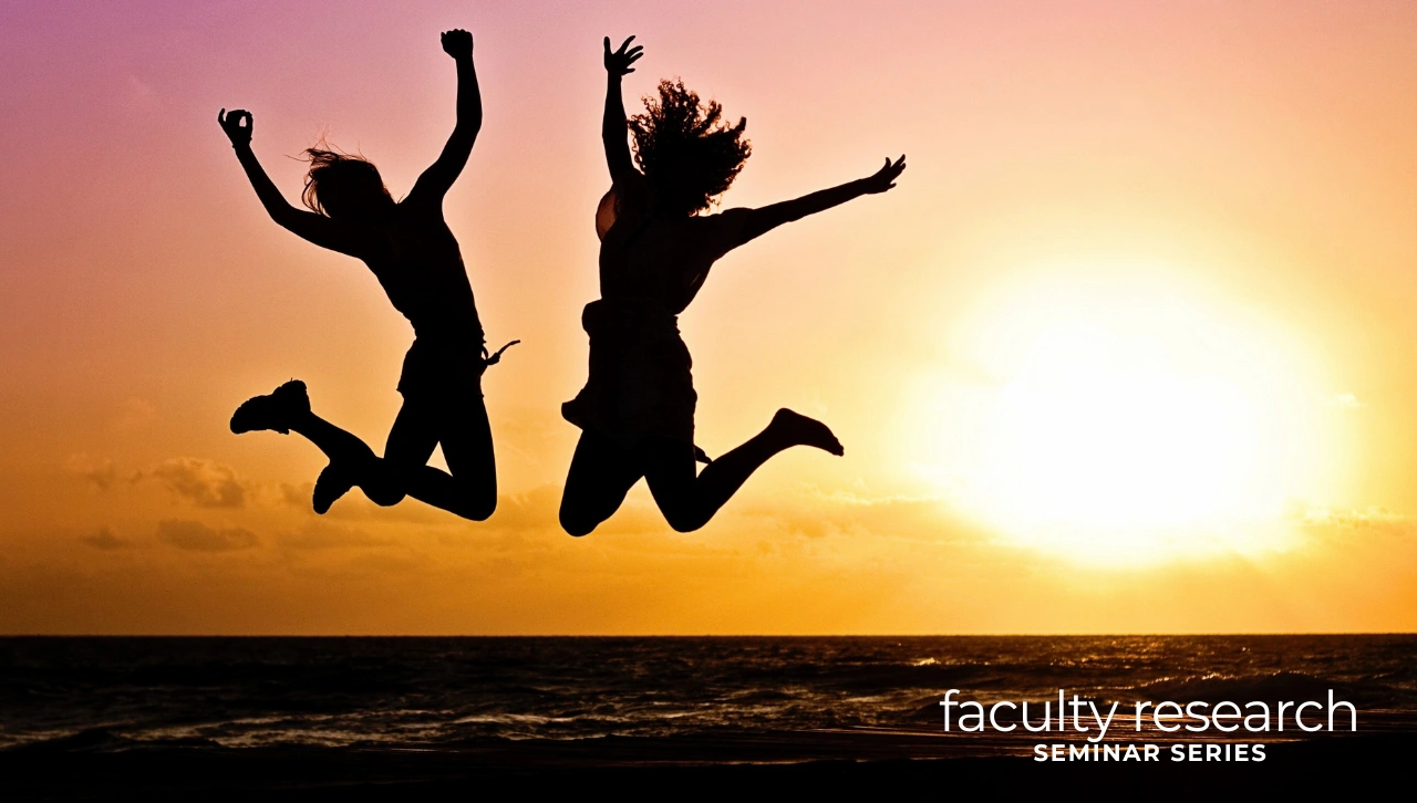 two silhouette figures jumping in the air against sunset-faculty research seminar series text 