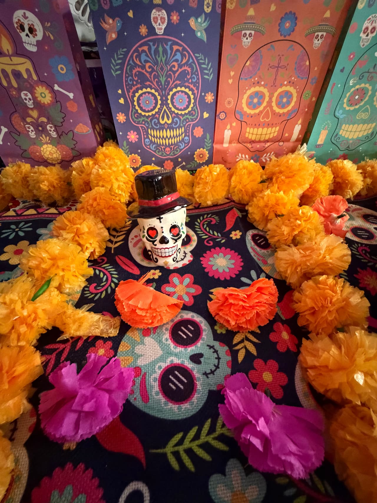 Dia de Los Muertos marigolds and ofrenda