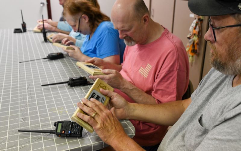 A gallery of images showing volunteers and Lackawanna Blind Association clients working together and celebrating their accomplishments.